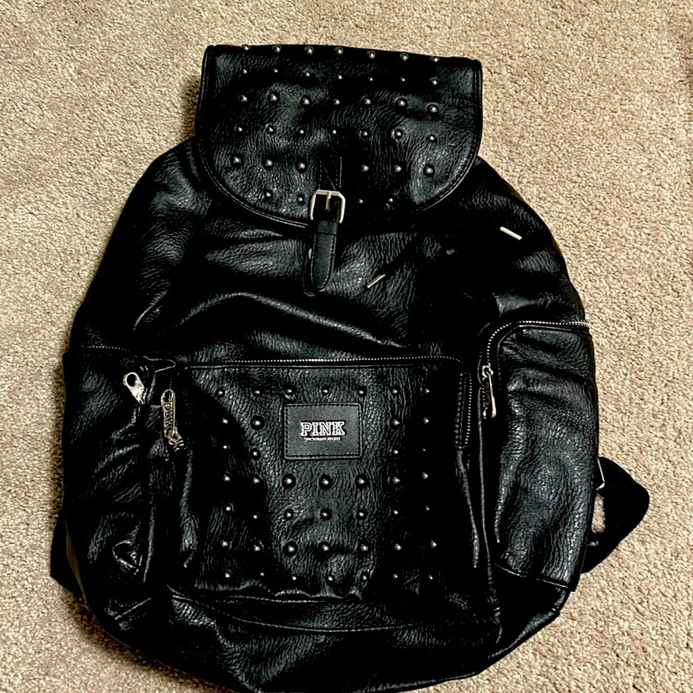 Pink leather like backpack.